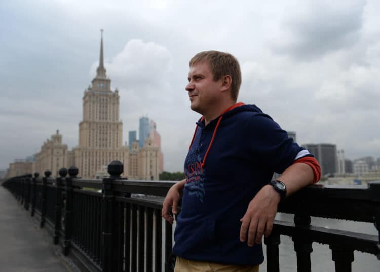 mos20:Photo by James Hill/2 September 2015-Sergey Lebedev, the writer and author, in central Moscow with the Ukraine Hotel in the background.