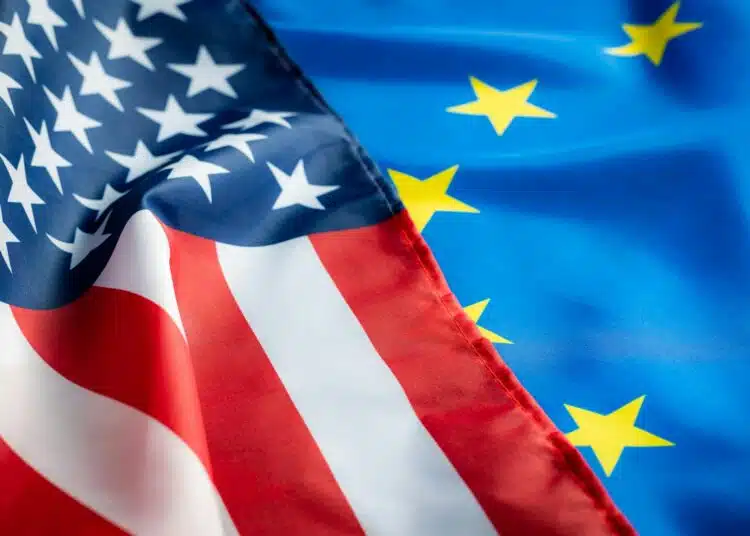 eu europe union flag and usa united states of america flag two waving flags