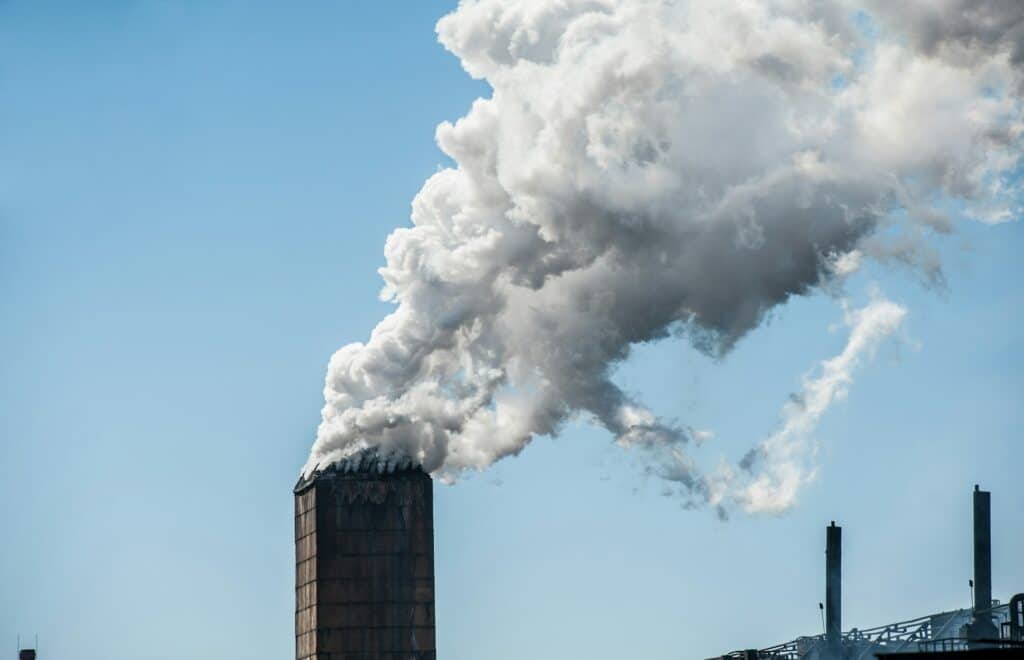 smoke from a pipe factory polluting air environmental problems