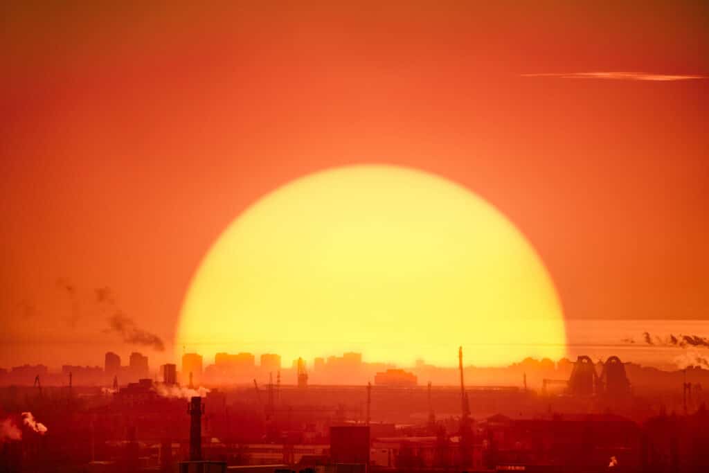 sunrise over city skyline with smokestacks and cra 2026 03 17 07 15 11 utc scaled 1