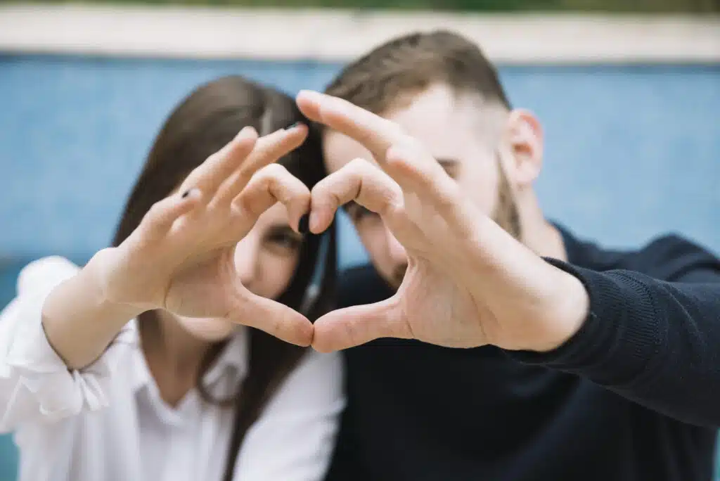 couple forming heart with hands1 0b850ef0