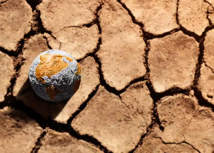 dry earth with globe symbolizing climate change 2026 03 25 09 20 46 utc scaled 1