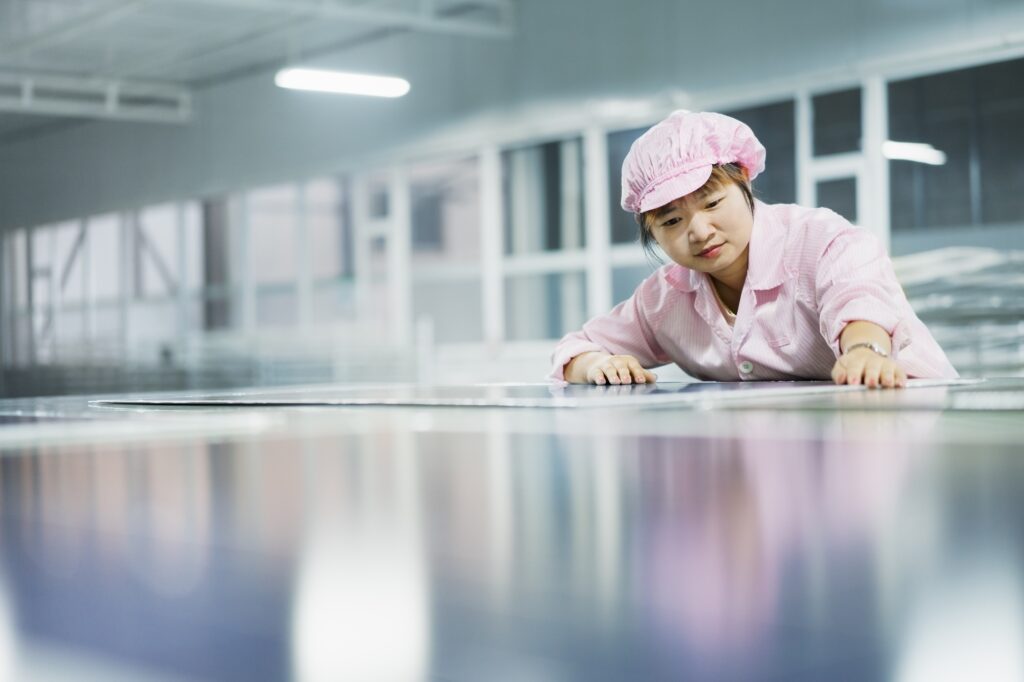 female worker in solar panel assembly factory solar valley dezhou china