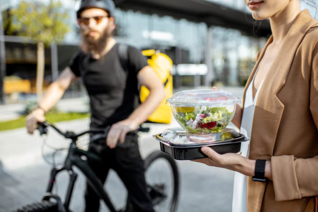 food delivery person bringing salad to customer 2026 01 09 06 50 11 utc scaled 1