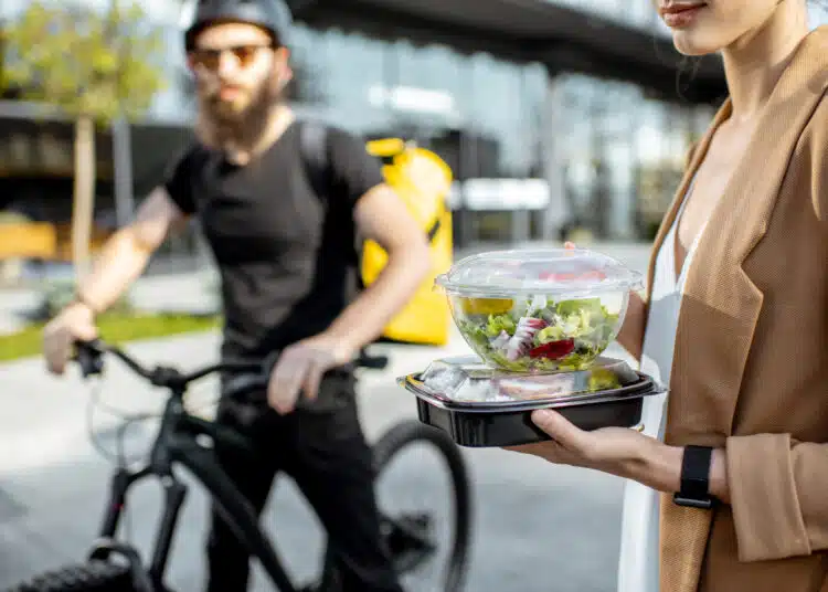 food delivery person bringing salad to customer 2026 01 09 06 50 11 utc scaled 1