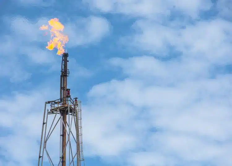 methane gas fire high flare stack flaring tower platform in refinery petroleum plant or flame