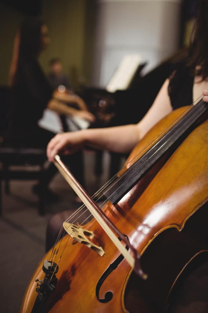 mid section female student playing double bass c00f9e69