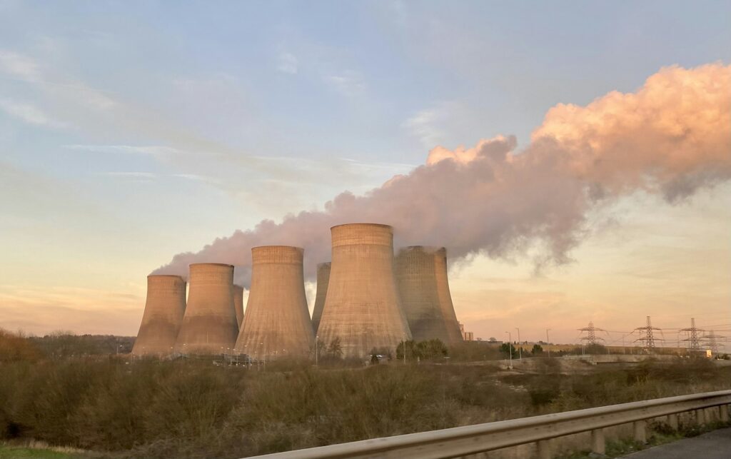 power station chimneys belching steam environmental impact fossil fuel