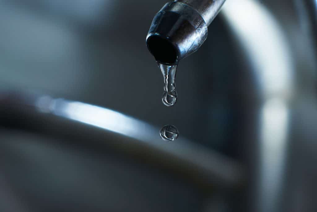 reverse osmosis filter tap closeup with dripping water drop