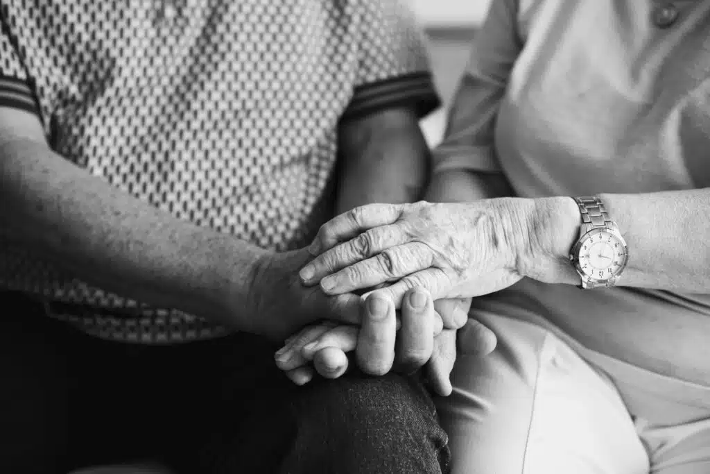 senior couple holding hands together 33213ffc