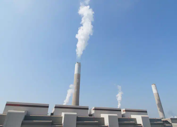 smoke from chimney in factory over blue sky 2026 03 24 23 04 26 utc scaled 1