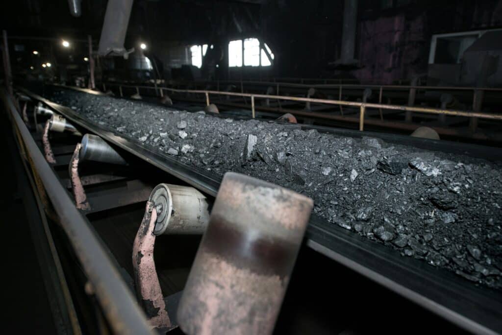 black coal on a conveyor belt the production process in the thermal power plant