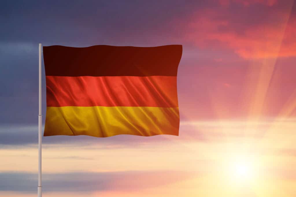 dramatic german flag waving against a colorful sun 2026 03 17 04 49 55 utc scaled 1