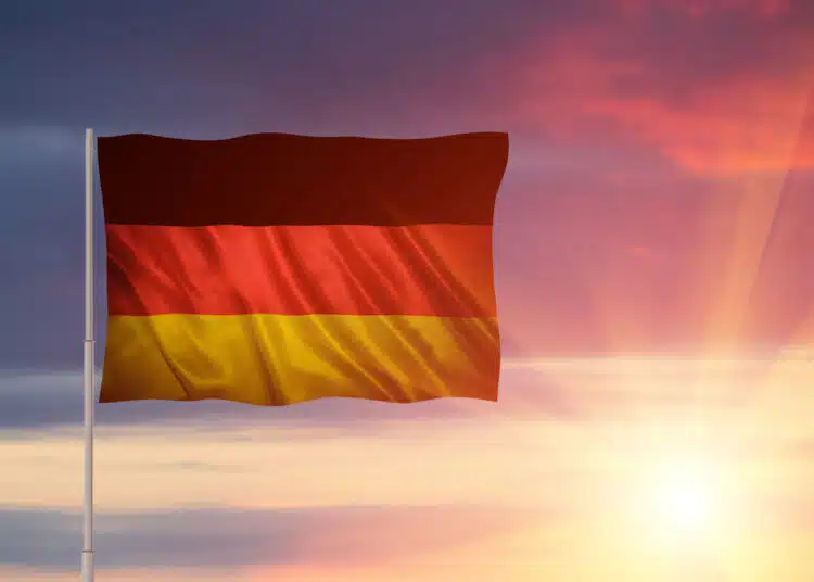 dramatic german flag waving against a colorful sun 2026 03 17 04 49 55 utc scaled 1